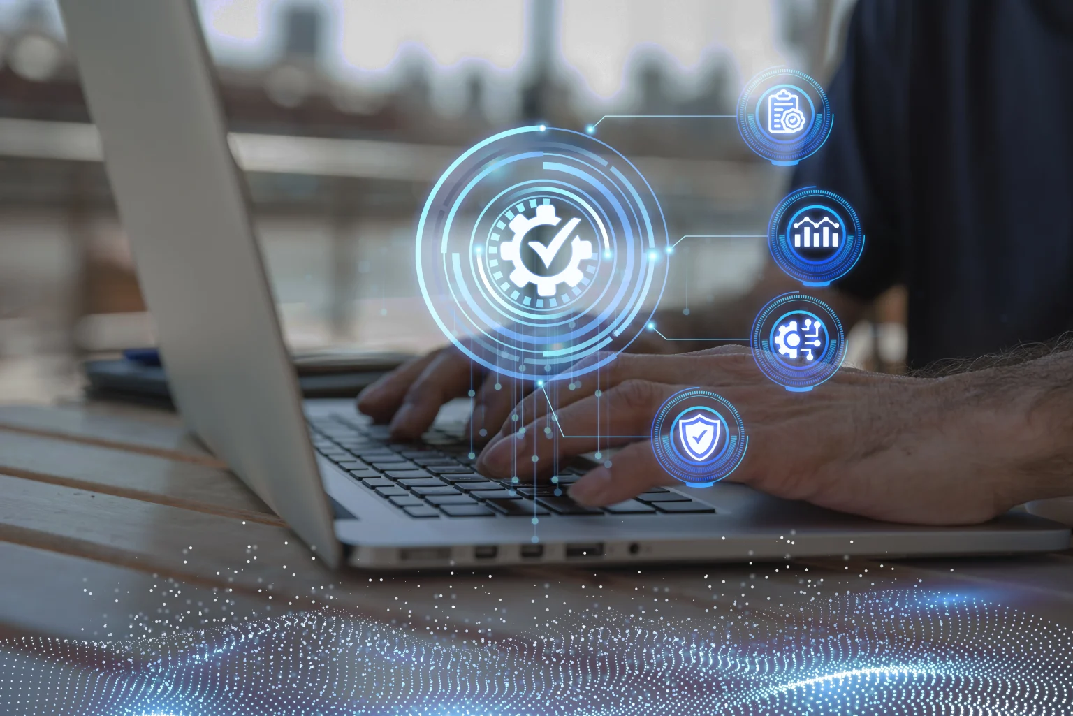 Person typing on a laptop with digital icons representing quality control, data analysis, process automation, and cybersecurity overlayed on the screen.