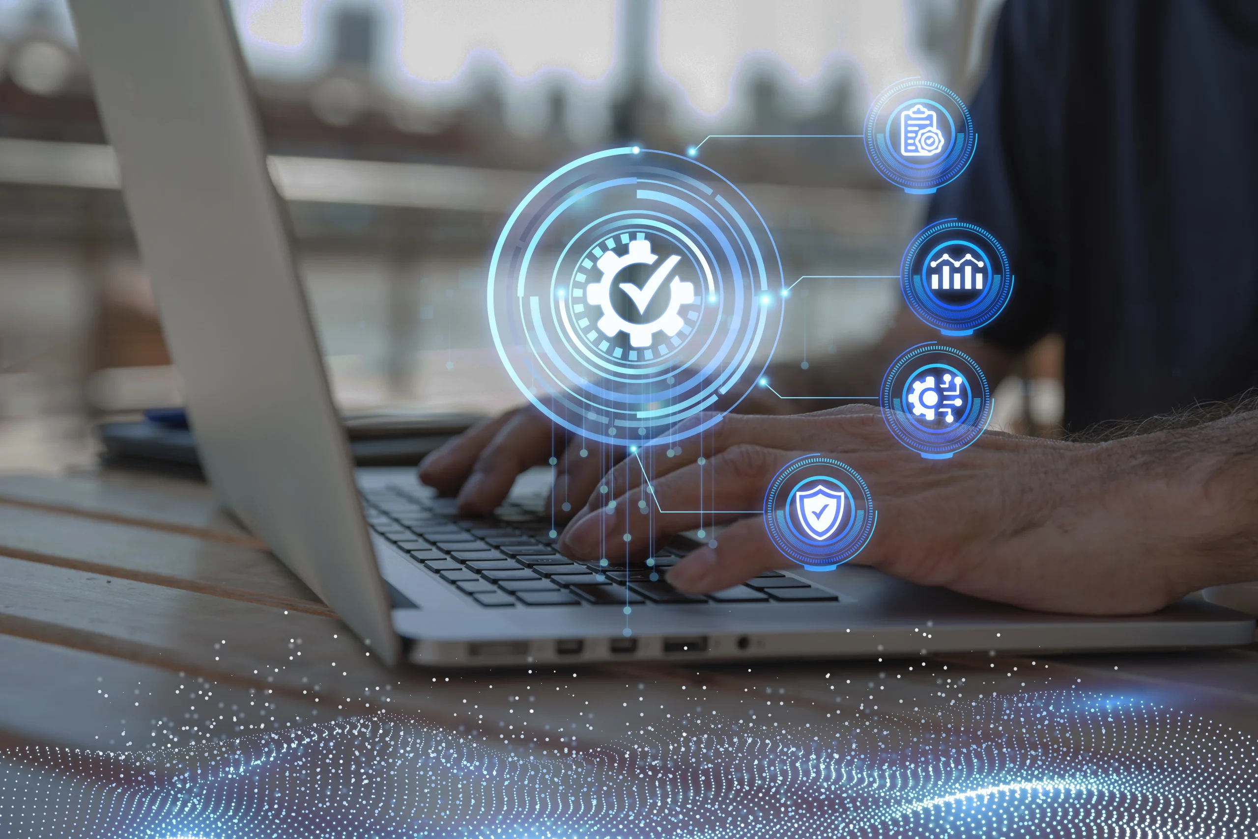 Person typing on a laptop with digital icons representing quality control, data analysis, process automation, and cybersecurity overlayed on the screen.